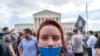 An abortion-rights protester wearing tape that reads "2nd Class Citizen" demonstrates following Supreme Court's decision to overturn Roe v. Wade outside the Supreme Court in Washington.