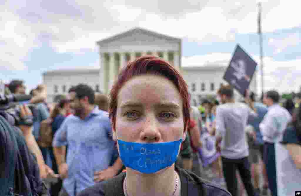 An abortion-rights protester wearing tape that reads "2nd Class Citizen" demonstrates following Supreme Court's decision to overturn Roe v. Wade outside the Supreme Court in Washington.