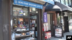 Various local newspapers appear outside a convenience store in the Brooklyn borough of New York on June 30, 2022. 