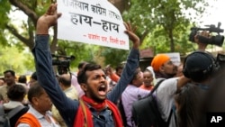 Activists from right wing Hindu parties protest in New Delhi, India, against the Tuesday killing of Kanhaiya Lal, a Hindu man, in a suspected religious attack in western Udaipur city, June 29, 2022. 