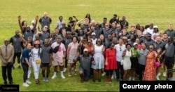 Group photo of Sables players, managers and Zimbabweans living in The Netherlands