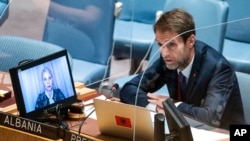 FILE - Ferit Hoxha, permanent representative of Albania to the United Nations, speaks during a meeting of the U.N. Security Council, June 21, 2022, at U.N. headquarters.