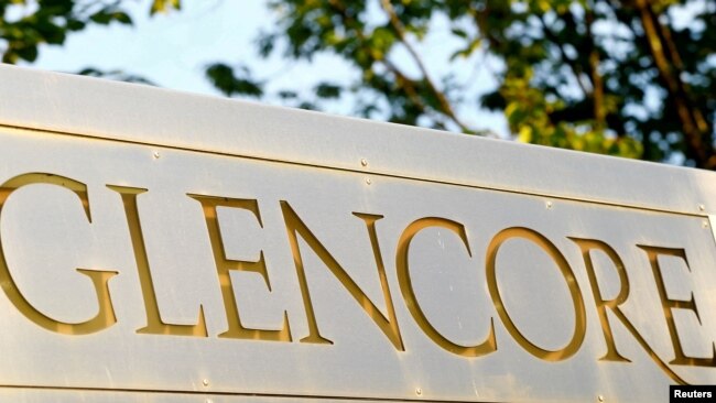 FILE - The logo of commodities trader Glencore is pictured in front of the company's headquarters in Baar, Switzerland, July 18, 2017.