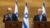 Israel's Prime Minister Naftali Bennett, left, and Foreign Minister Yair Lapid make a joint statement to the press in Jerusalem on June 20, 2022.