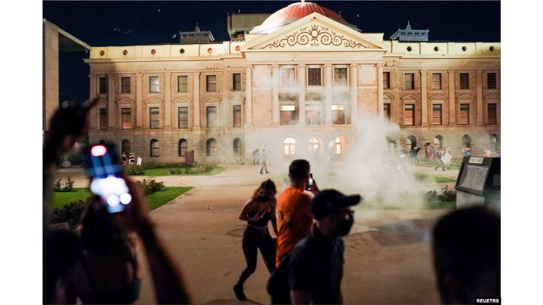 Arizona state troopers deploy tear gas as they confront abortion rights protesters during a protest at the Arizona Capitol, following the U.S. Supreme Court ruling to overturn abortion rights established under Roe v. Wade, Phoenix, Arizona, June 24, 2022.