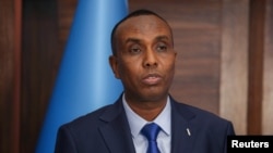 Somalia's newly appointed prime minister, Hamza Abdi Barre, addresses delegates at the Presidential Palace in Mogadishu, Somalia, June 15, 2022. 