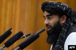 FILE - Taliban spokesman Zabihullah Mujahid speaks during a press conference in Kabul, Afghanistan, June 30, 2022.