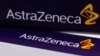 FILE - The logo of AstraZeneca is seen on medication packages in a pharmacy in London. Apr. 28, 2014.