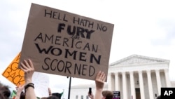 People protest following the Supreme Court's decision to overturn Roe v. Wade in Washington, June 24, 2022. 