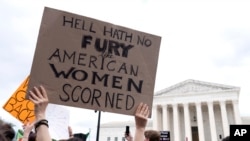 People protest following the Supreme Court's decision to overturn Roe v. Wade in Washington, June 24, 2022. 