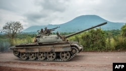 FILE - A Congolese army tank heads towards the front line near Kibumba in the area surrounding the North Kivu city of Goma during clashes between the Congolese army and M23 rebels, 5.25.2022