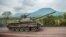 FILE - A Congolese army tank heads towards the front line near Kibumba in the area surrounding the North Kivu city of Goma during clashes between the Congolese army and M23 rebels, May 25, 2022.
