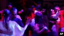 Couples dance at a dance club in Damascus, Syria, June 13, 2022. (AP Photo/Omar Sanadik)