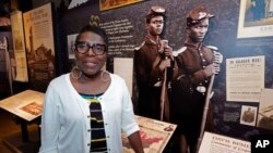 Pamela Junior, director of The Two Mississippi Museums, speaks about the historical roots of Juneteenth, as she stands before one of the exhibits in the Mississippi Civil Rights Museum, June 16, 2022, in Jackson.