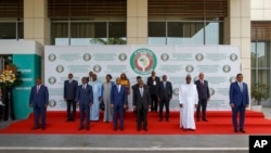 FILE - ECOWAS heads of states and other representative pose for a family photo during the fifth extraordinary summit in Accra, Ghana, March 25, 2022.