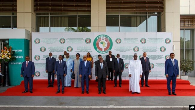 FILE - ECOWAS heads of states and other representative pose for a family photo during the fifth extraordinary summit in Accra, Ghana, March 25, 2022.