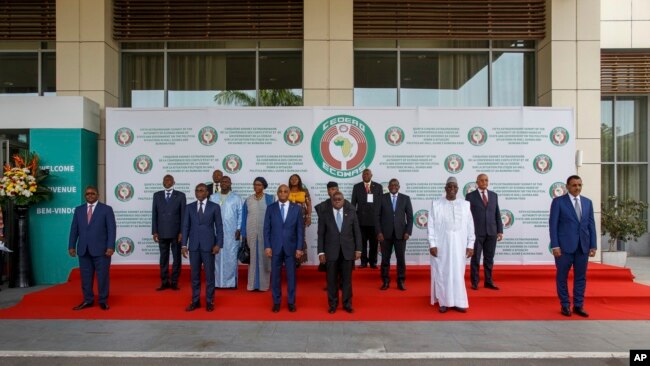 FILE - ECOWAS heads of states and other representative pose for a family photo during the fifth extraordinary summit in Accra, Ghana, March 25, 2022.