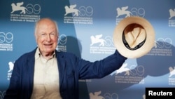FILE - British director Peter Brook poses during a photocall of the movie "The Tightrope" at the 69th Venice Film Festival in Venice, Italy, Sept. 5, 2012.