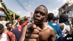 FCILE: A demonstrator gestures as he and others try to reach the border between Democratic Republic of Congo and Rwanda during a protest in Goma. Photo taken June 15, 2022.