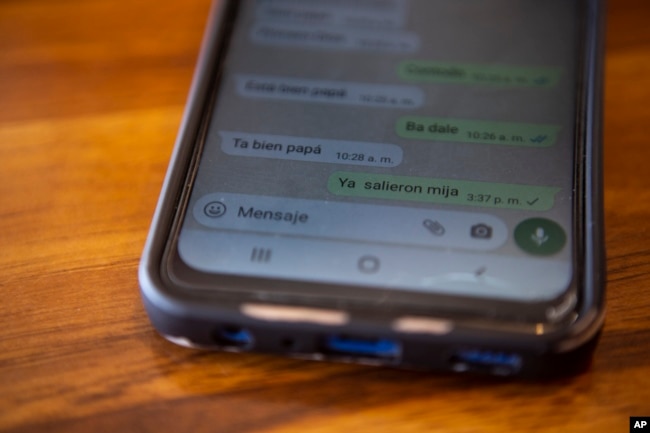 An unanswered message where a question is read "have you left Mija?" is seen on the cell phone of Yenifer Yulisa Cardona Tomás' father, Mynor Cardona, during an interview in Guatemala City, Monday, July 4, 2022. (AP Photo/Oliver de Ros)