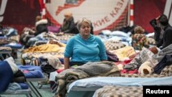 FILE - Residents of the Ukrainian city of Mariupol stay at a temporary accommodation center for evacuees in a local school in Taganrog in the Rostov region, Russia, March 23, 2022. 