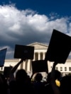 Abortion-rights activists protest outside the Supreme Court in Washington, June 25, 2022.