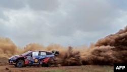 Belgian driver Thierry Neuville steers his Hyundai i20 N with Belgian co-driver Martijn Wydaeghe during the Super Special Stage of Safari Rally Kenya 2022, the 6th round of the FIA World Rally Championship, in Nairobi.