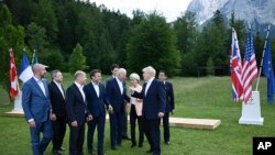 Britain's Prime Minister Boris Johnson, second right, speaks with from left, European Council President Charles Michel, Italy's Prime Minister Mario Draghi, Germany's Chancellor Olaf Scholz, France's President Emmanuel Macron, US President Joe Biden, Eur