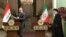 Iranian President Ebrahim Raisi and Iraqi Prime Minister Mustafa al-Kadhimi arrive for a news conference in Tehran, Iran, June 26, 2022. (President Website/West Asia News Agency/Handout via Reuters)