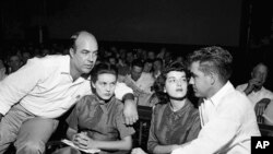 FILE - In this Sept. 23, 1955, file photo, J.W. Milam, left, his wife, second from left, Roy Bryant, far right, and his wife, Carolyn Bryant, sit together in a courtroom in Sumner, Miss.