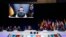 FILE: Ukraine's President Volodymyr Zelenskyy addresses leaders via a video screen during a round table meeting at a NATO summit in Madrid, Spain, 6.29.2022. On the next day, U.S. President Biden announced additional weapons and military assistance. 
