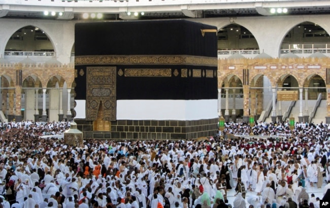 Thousands of Muslim pilgrims circumambulate around the Kaaba, the cubic building at the Grand Mosque, in the Saudi Arabia's holy city of Mecca, Tuesday, July 5, 2022. (AP Photo/Amr Nabil)