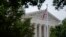 FILE - An American flag waves in front of the U.S. Supreme Court building, June 27, 2022, in Washington.
