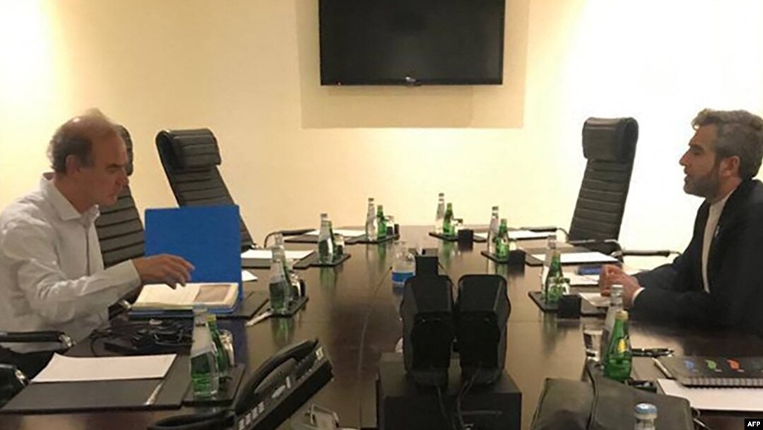 FILE - This handout from Iranian news agency IRNA shows Iranian chief nuclear negotiator Ali Bagheri Kani, right, meeting with European Union nuclear talks coordinator Enrique Mora in Doha, Qatar, June 28, 2022.