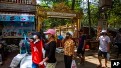 Protesters chant slogans and march in the street of Myaynigone township during the anti-coup demonstration in Yangon, Myanmar, April 9, 2021.