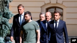 France's President Emmanuel Macron, right, Romanian President Klaus Iohannis, left, Prime Minister of Italy Mario Draghi, center, Ukraine President Volodymyr Zelenskyy, second left, and German Chancellor Olaf Scholz in Kyiv, June 16, 2022.