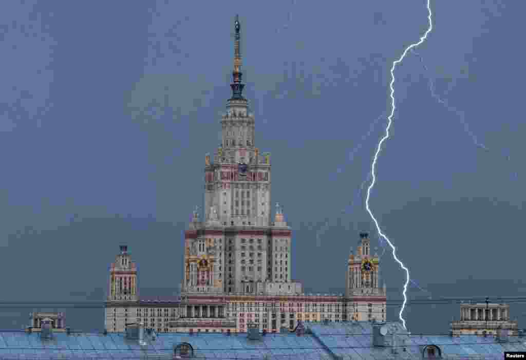 A lightning bolt strikes near Moscow State University building during a thunderstorm in Moscow, Russia.