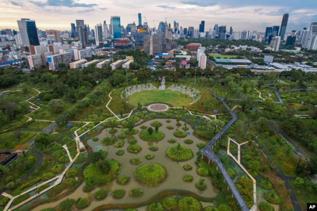 An aerail view shows the water features of Benjakitti Park in Bangkok, Thailand, Sunday, May 8, 2022. (AP Photo/Krit Phromsakla Na Sakolnakorn)