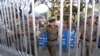 FILE - Myanmar border guards reopen on October 15, 2002 a major border crossing into Thailand at Tachilek, Chiang Rai province.