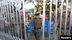 FILE - Myanmar border guards reopen on October 15, 2002 a major border crossing into Thailand at Tachilek, Chiang Rai province.
