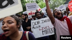 Members and supporters of All India Students' Association (AISA) shout slogans during a protest against what they say are attacks on Muslims, in New Delhi, India, June 13, 2022. 