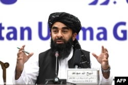 FILE - Taliban spokesman Zabihullah Mujahid speaks during a press conference in Kabul on June 30, 2022.