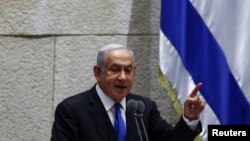 Mantan Perdana Menteri Israel Benjamin Netanyahu berbicara di hadapan para peserta rapat pleno di parlemen Israel, Knesset, Yerusalem, 30 Juni 2022.