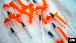 FILE - In this file photo taken on June 21, 2022 syringes containing the Moderna COVID-19 vaccination for 6 month olds to 5 year olds lay on a table waiting to be used at Temple Beth Shalom in Needham, Massachusetts, June 21, 2022. 