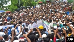 Rohingya refugees participate in a "Let's go home" rally demanding repatriation at the Kutupalong Rohingya camp in Cox's Bazar, Bangladesh, June 19, 2022.