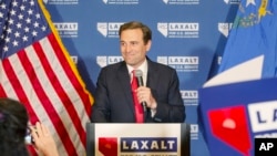 Nevada Republican US Senate candidate Adam Laxalt celebrates his victory with family, friends and supporters at the Tamarack Casino in Reno, Nev., June 14, 2022. (