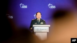 FILE - China's Defense Minister Wei Fenghe speaks at a plenary session during the 19th International Institute for Strategic Studies Shangri-la Dialogue, Asia's annual defense and security forum, in Singapore, June 12, 2022.