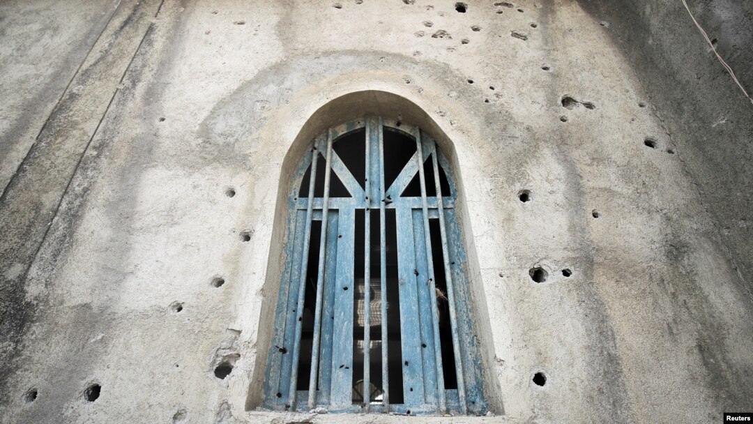 FILE - Bullet holes are seen on a mosque, caused by fighting between the Ethiopian National Defense Force (ENDF) and the Tigray People's Liberation Front (TPLF) forces in Kasagita town, Afar region, Ethiopia, Feb. 25, 2022.
