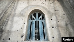 FILE - Bullet holes are seen on a mosque, caused by fighting between the Ethiopian National Defense Force (ENDF) and the Tigray People's Liberation Front (TPLF) forces in Kasagita town, Afar region, Ethiopia. Taken 2.25.2022