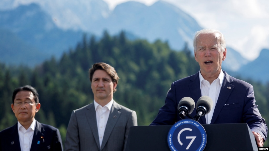 U.S. President Joe Biden speaks next to Japanese Prime Minister Fumio Kishida and Canadian Prime Minister Justin Trudeau during the first day of the G7 leaders' summit at Bavaria's Schloss Elmau castle, Germany, June 26, 2022. 